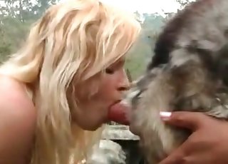 Lovely blonde fuckdoll is performing a blowjob on a mutt