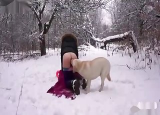 Amateur with a platinum-blonde hair fucking a dog in the snow